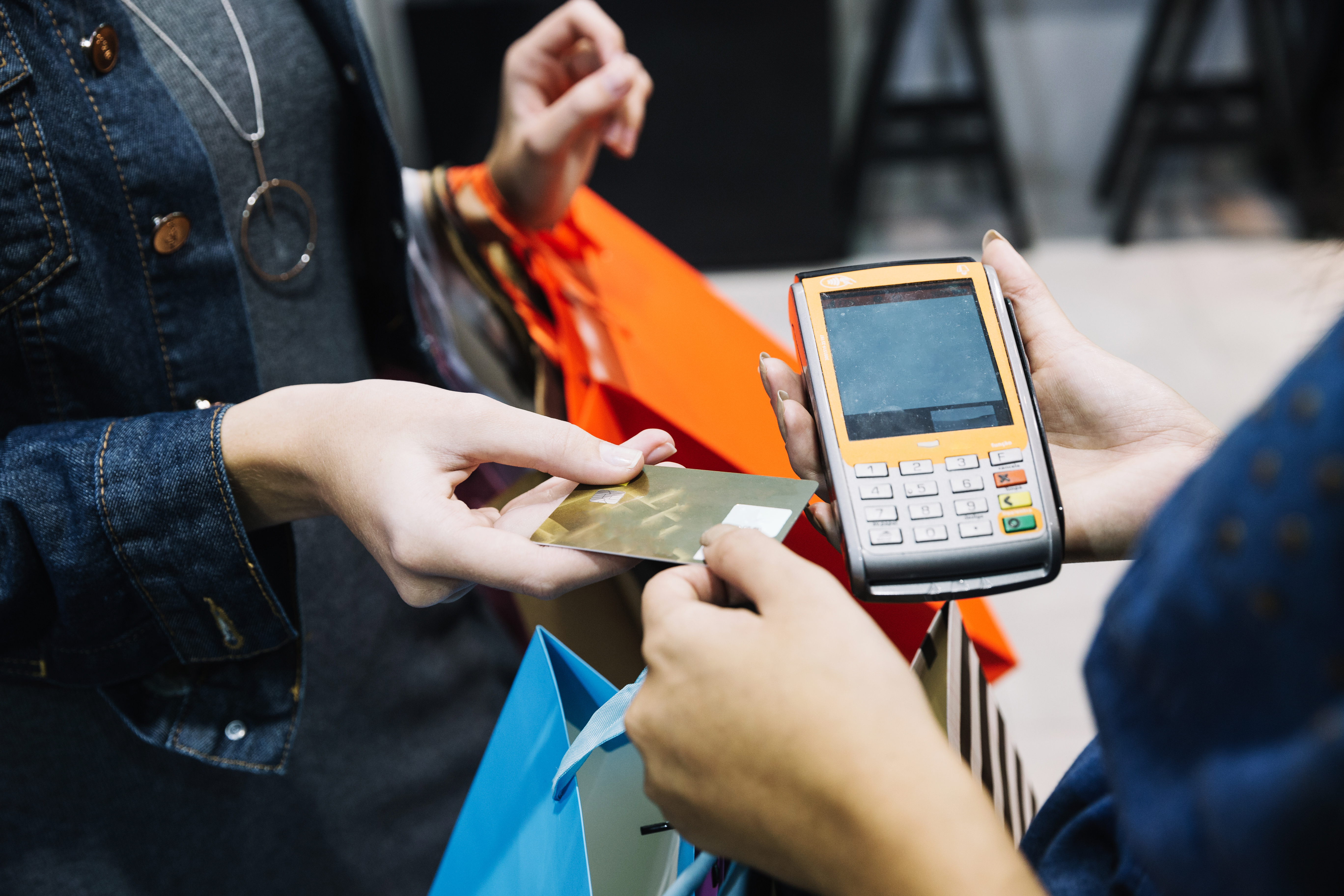 anonymous-woman-paying-shop